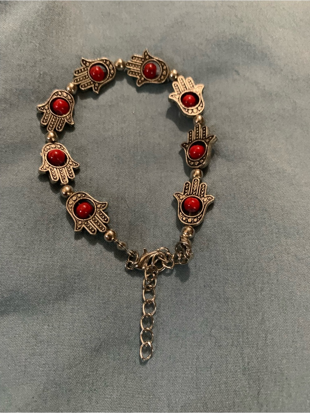 Silver Hamsa Hand Bracelet with Red Stones
